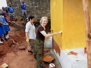 At a school in Kissi area of Freetown, helping with building and painting of extra toilets at the school.