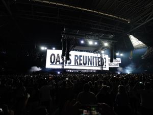Supporting image for story: Oasis take to stage for first gig in 16 years to jumping crowd and flying cups