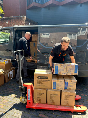 Simon Dennis, Managing Director and Andy Haycock, Ops Manager of Jointing Tech unloading the donation of essential supplies for Compton Care.