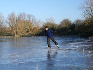 Supporting image for story: Ice skaters make most of freezing conditions on flooded Fenland fields