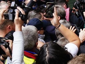 Supporting image for story: Hundreds greet Kneecap rapper as he arrives at court on terror charge