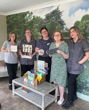 Colleagues at HC-One’s Sedgley Court Care Home with gardening prize hamper