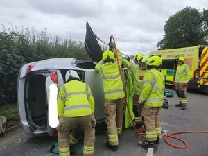 The car overturned on Himley Road, near to the entrance of Himley Hall. Photo: Dudley Fire Station