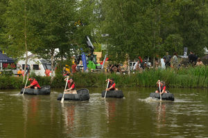A coracle race on the pool in the countryside pursuits area of the show. Image by Andy Compton
