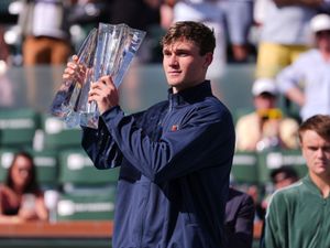 Jack Draper holds aloft the trophy