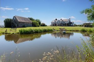 The seven-bedroom home near Pattingham boasts expansive grounds featuring a large pond, pontoon and boat house. Picture: Rightmove/Peter James Property Ltd.