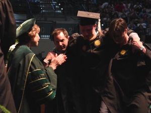 Supporting image for story: This wheelchair-bound student walking to collect his Masters degrees is the most inspiring thing you'll see all day