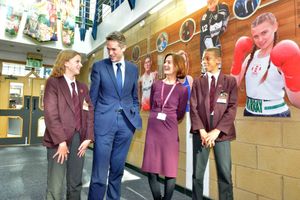 Telford MP Lucy Allan and Education Secretary Gavin Williamson in Thomas Telford School's corridor of fame with pupils Imogen West, 12, and Abel Bello,13