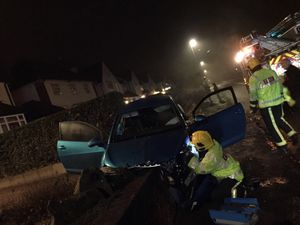 Supporting image for story: 'Stolen' car wedged between walls in crash after suspected burglaries