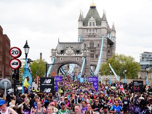 Runners cross Tower Bridge during the TCS London Marathon in 2024