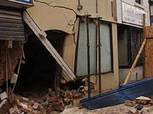 Supporting image for story: Car smashes into three buildings