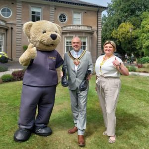 Custard the Bear,  Mayor of Wolverhampton Councillor Craig Collingswood and Jenny Warren (Director of Clinical Services at Compton Care) are encouraging people to walk for Compton