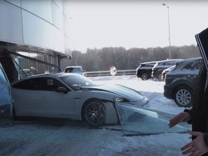 Supporting image for story: Russian YouTuber crashes Porsche Taycan through dealership window