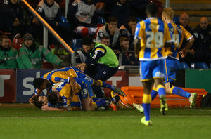 Shaun Whalley of Shrewsbury Town is mobbed by his team mates after he scores to make it 1-2. (AMA)