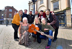 Musician Kerry Worton poses with Ned's Atomic Dustbin's Jonn Penney, and fellow musicians and venue owners ahead of the One Heart One Way festival