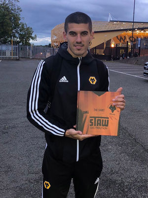 Conor Coady, with a copy of the book