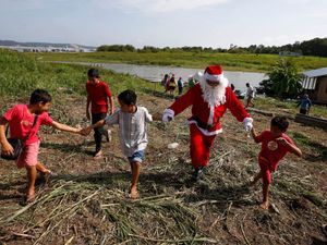 Supporting image for story: Santa braves sticky heat of Amazon jungle to bring gifts to children