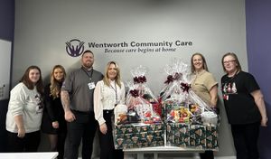 Staff at Wentworth Community Care with some of the hampers they have donated to help people at Christmas