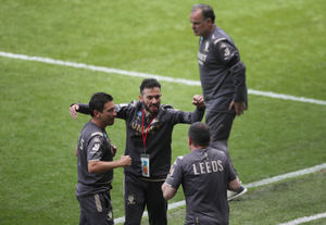  Carlos Corberan (bottom centre) celebrates win over Swansea City with Leeds United manager Marcelo Bielsa (top) looking on during the Sky Bet Championship match at The Liberty Stadium, Swansea