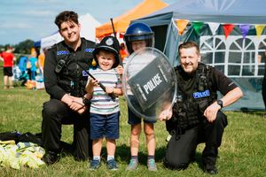 Pc Sumara, three-year-old Arlo Macleod, Jenson Macleod, aged six, and Pc Hughes at the festival