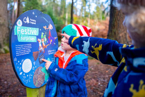 Children looking at a Room on the Broom panel.
