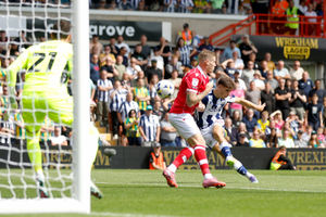 James McClean of Wrexham AFC blocks both the shot and the player Tom Fellows of West Bromwich Albion during the Sky Bet Championship match between Wrexham AFC and West Bromwich Albion at Racecourse Ground on August 16, 2025 in Wrexham, United Kingdom. (Photo by Adam Fradgley/West Bromwich Albion FC via Getty Images)