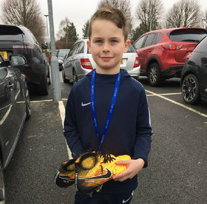 Oliver with the boots from David Luiz