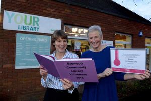 Volunteers Sue Hayes and Claire Warburton outside the library
