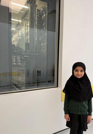 Youngsters can watch the pharmacy robot in action through a viewing window in the waiting area.