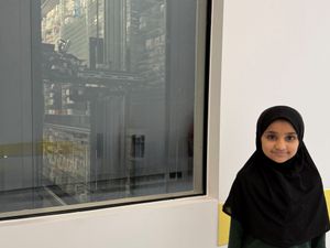 Supporting image for story: Youngsters catch pharmacy robot in action at new facility