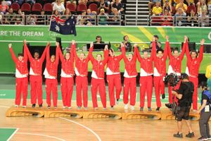 Allen and the rest of the Team England squad raise their hands with joy on the rostrum. Picture: @5or6