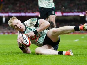 A sliding Jamie Osborne scores a try for Ireland against Wales