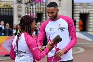 Kadeena Cox OBE passes the Baton to Declan James at the launch of the Birmingham 2022 Queen's Baton Relay on October 7 2021