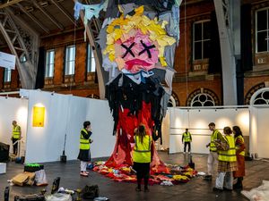 Supporting image for story: Students send climate message with giant Boris Johnson artwork made from clothes