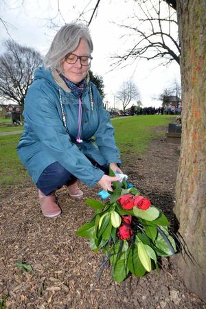 Claire Hughes from Tipton, who has links to the Morris and Greensill families who had members killed, lays flowers