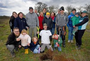 Roots Allotments site manager Dave Cox and members of the allotment who took part in the tree planting