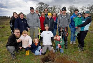 Roots Allotments site manager Dave Cox and members of the allotment who took part in the tree planting