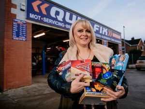 Supporting image for story: Telford garage fixing up Christmas with toy donation to sick children