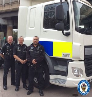 Officers with a police HGV cab used to look for truckers using phones at the wheel