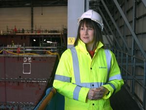 Rachel Reeves wearing a hard hat and a hi-vis jacket