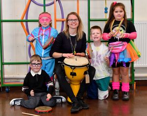 Miriam Kitchener from Entrust Music Service with children from Burton Manor Primary School, Stafford, who enjoyed a drumming session to celebrate the school's 70th anniversary