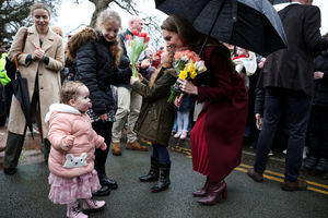 The Princess of Wales is greeted by children presenting her with flowers as she arrives to visit the Oriel Davies art gallery in Newtown to see a project supporting the wellbeing of the children and young people in the local area, ahead of St David's Day. Picture date: Thursday February 26, 2026. PA Photo. Photo credit: Phil Noble/PA Wire