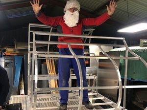 Santa tries out the new Rotary sleigh whilst it is still in the workshop.