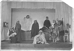 Cyril Randle, at the back on the far right, believes it is Aubrey Fellows as the shepherd, seated front, and Doreen Lloyd as the angel
