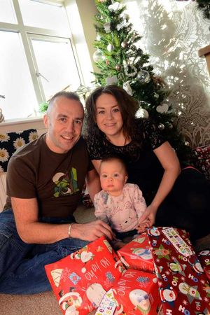 Daisy with her parents for the first Christmas at home following care