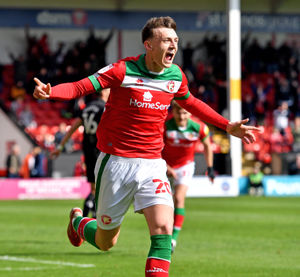 Sam Perry scores and celebrates