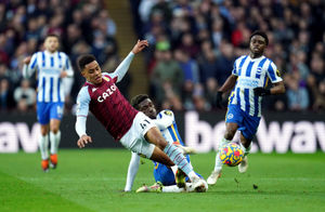 Aston Villa's Jacob Ramsey is tacked by Brighton and Hove Albion's Yves Bissouma
