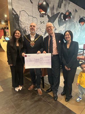 COSMO staff presenting a cheque to the Mayor of Wolverhampton, Councillor Craig Collingswood.