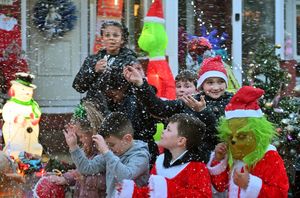 A photograph of the Christmas street party for Tommy to enjoy outside his window in the house.